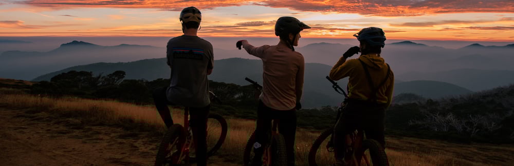 Mountain bikers take in the stunning alpine views at Mt Buller where there are 60+kms of trails to explore