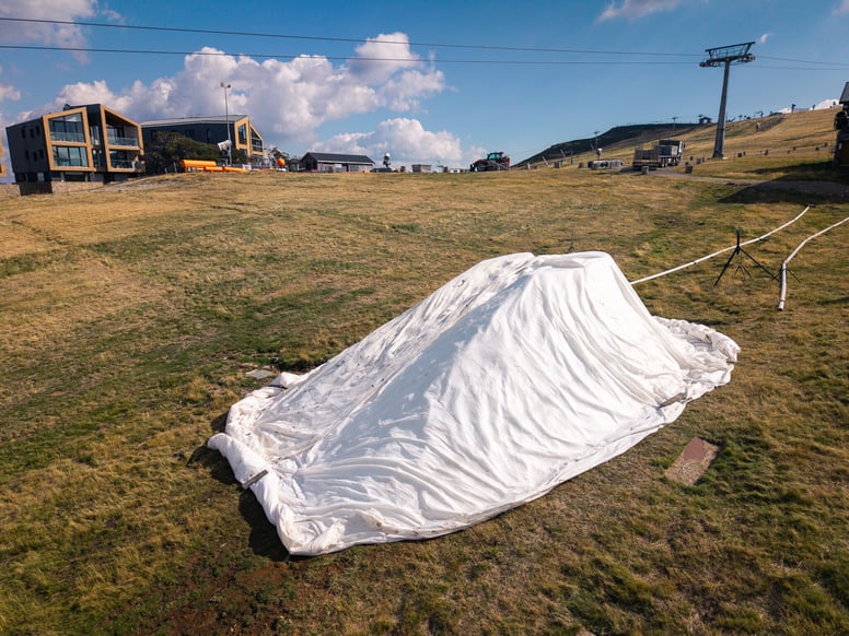 A small pile of snow on Bourke Street was made by the all-weather snow factory and is wrapped with protective covers