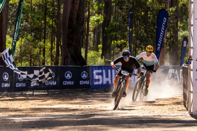 MTB racers hit the finish line in the National Championships on Mt Buller : image Auscyclng