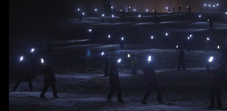Ski Patrollers carried torches and lit the Bourke Street ski run in celebration