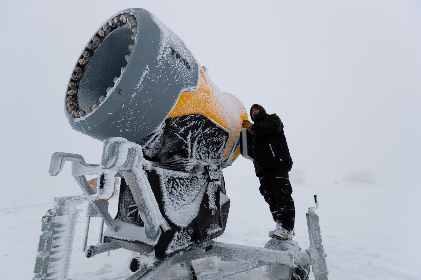 Inspecting a snowmaking fan gun